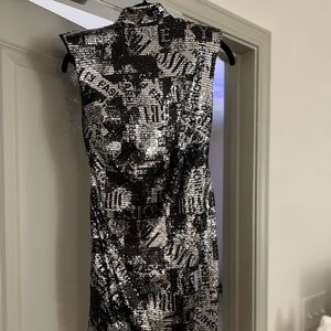 Sequin dress with open back and shoulder pads!